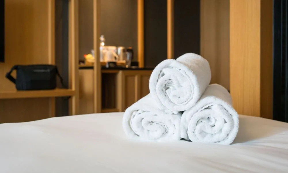 Fresh rolled towels arranged in a relaxing wellness setting at a spa in Coimbatore