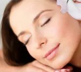 Woman relaxing during a soothing spa massage in Coimbatore.